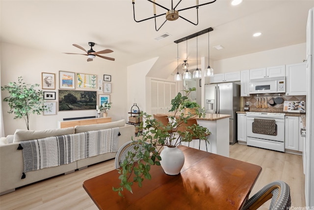 91-1021 Kaileolea Dr Unit H3, Ewa Beach, HI 96706 - dining space with light wood-style floors, a chandelier, a ceiling fan, and recessed lighting