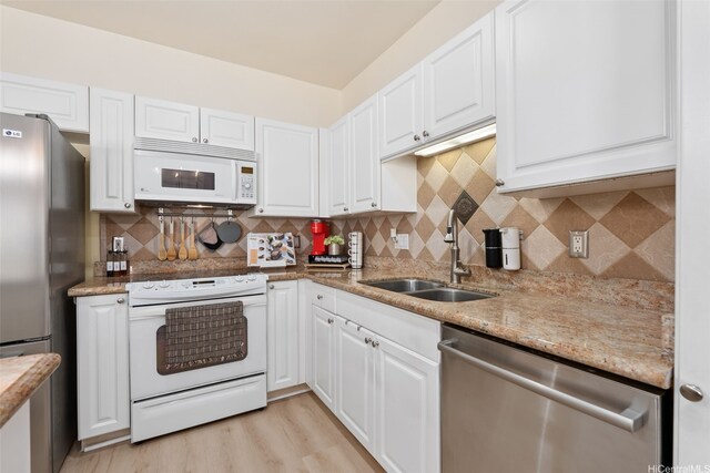 91-1021 Kaileolea Dr Unit H3, Ewa Beach, HI 96706 - kitchen with stainless steel appliances, white cabinetry, backsplash, and light stone countertops