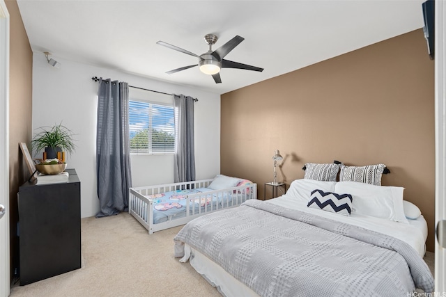 91-1021 Kaileolea Dr Unit H3, Ewa Beach, HI 96706 - bedroom with light carpet and a ceiling fan