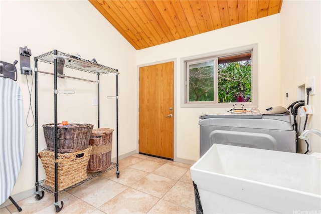 84-1369 Maunaolu St, Waianae, HI 96792 - washroom with washing machine and clothes dryer, wooden ceiling, and light tile patterned flooring