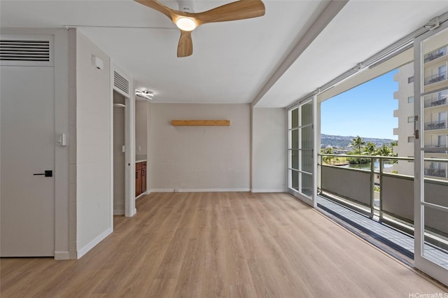 445 Kaiolu St Unit 401, Honolulu, HI 96815 - unfurnished room featuring wood finished floors and a ceiling fan