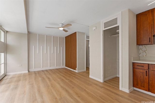 445 Kaiolu St Unit 401, Honolulu, HI 96815 - unfurnished living room featuring a ceiling fan and light wood-style flooring