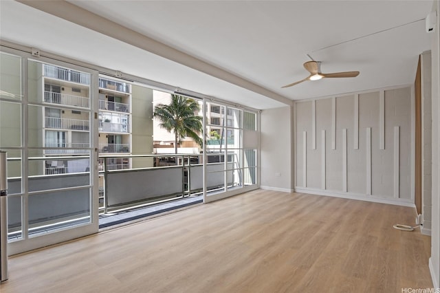445 Kaiolu St Unit 401, Honolulu, HI 96815 - spare room featuring wood finished floors and a ceiling fan