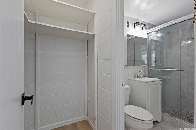 445 Kaiolu St Unit 401, Honolulu, HI 96815 - bathroom with a shower stall, vanity, and wood finished floors