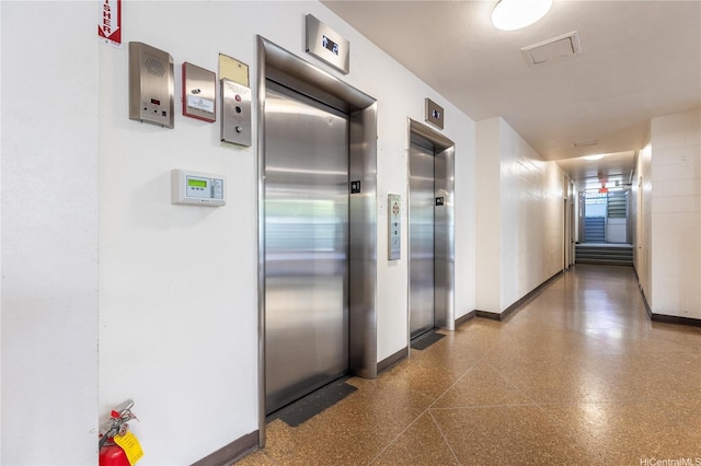 445 Kaiolu St Unit 401, Honolulu, HI 96815 - hall with elevator and light aggregate flooring