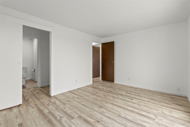 94-1069 Anania Cir Unit 16, Mililani, HI 96789 - empty room featuring light wood finished floors and baseboards
