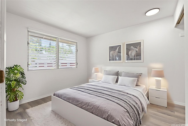 94-1069 Anania Cir Unit 16, Mililani, HI 96789 - bedroom featuring wood finished floors and baseboards