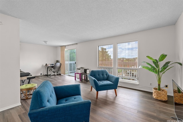 94-1069 Anania Cir Unit 16, Mililani, HI 96789 - living room featuring an office area, wood finished floors, and a textured ceiling