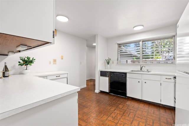 94-1069 Anania Cir Unit 16, Mililani, HI 96789 - kitchen featuring black dishwasher, brick patterned flooring, light countertops, and white cabinets