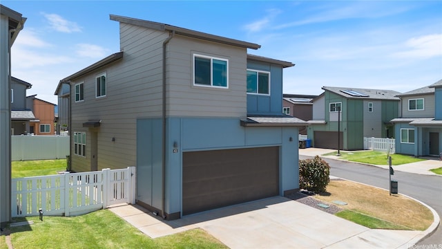 91-1641 Honouliuli St Unit 42, Ewa Beach, HI 96706 - contemporary house with an attached garage and driveway