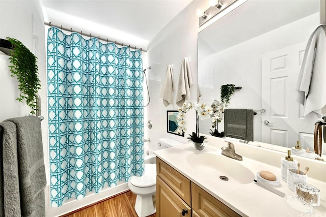 91-1517 Wahane St, Kapolei, HI 96707 - bathroom with vanity, shower / bathtub combination with curtain, and wood finished floors