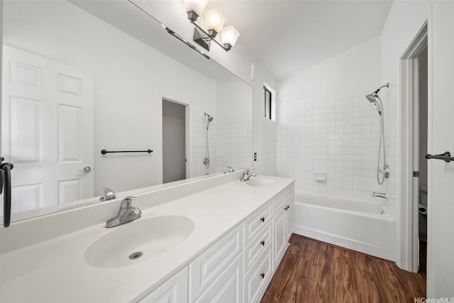 91-1517 Wahane St, Kapolei, HI 96707 - full bathroom with double vanity, bathing tub / shower combination, wood finished floors, and vaulted ceiling