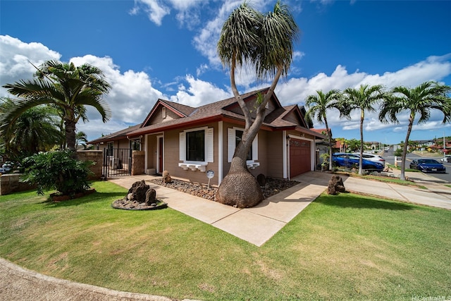 91-1517 Wahane St, Kapolei, HI 96707 - view of front of property with an attached garage, driveway, and a gate