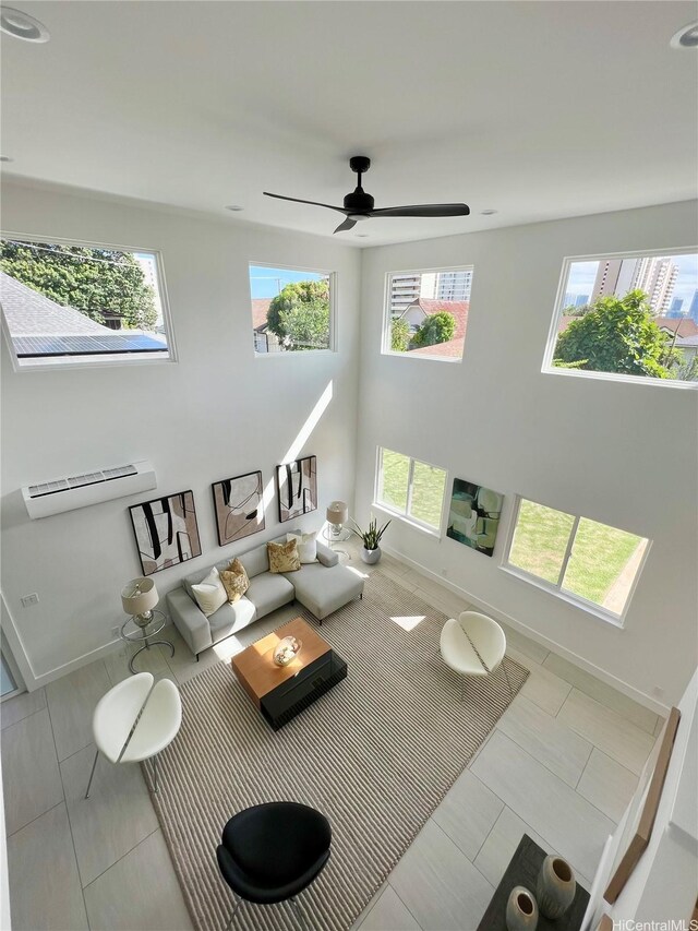 1689 Lewalani Dr, Honolulu, HI 96822 - living area with a ceiling fan, tile patterned flooring, and a wall mounted AC