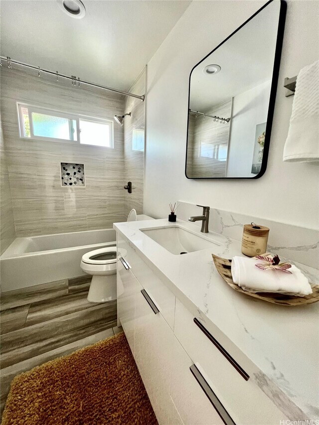 1689 Lewalani Dr, Honolulu, HI 96822 - full bathroom with bathtub / shower combination, vanity, and wood finished floors