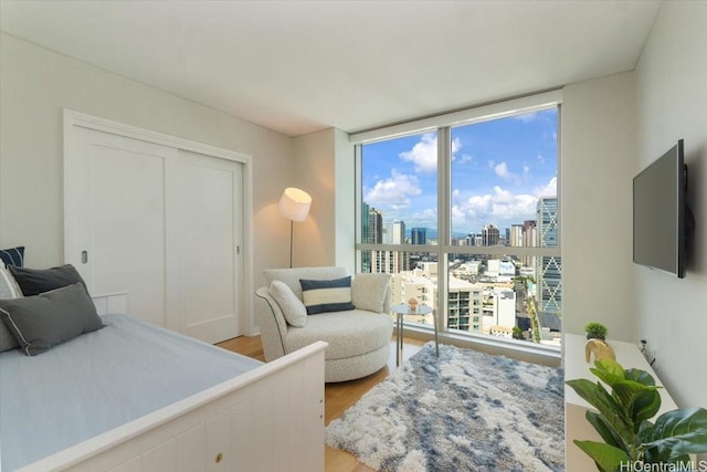 1177 Queen St Unit 3401, Honolulu, HI 96814 - bedroom with floor to ceiling windows and light wood-style floors