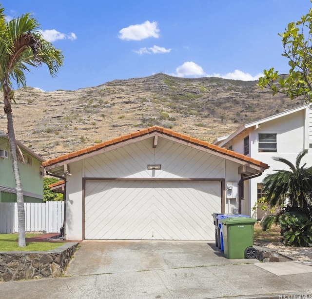 1482 Honokahua St, Honolulu, HI 96825 - garage featuring a mountain view and concrete driveway