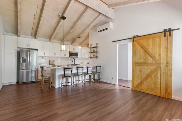 1482 Honokahua St, Honolulu, HI 96825 - kitchen featuring stainless steel appliances, a wall mounted air conditioner, a kitchen bar, white cabinetry, and dark wood-style flooring