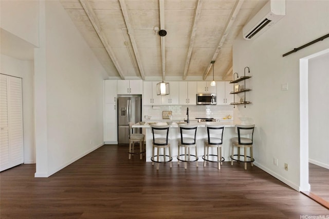 1482 Honokahua St, Honolulu, HI 96825 - kitchen with appliances with stainless steel finishes, a wall mounted AC, a kitchen breakfast bar, light countertops, and backsplash