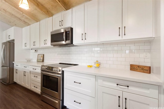 1482 Honokahua St, Honolulu, HI 96825 - kitchen featuring stainless steel appliances, wooden ceiling, white cabinetry, dark wood-type flooring, and light countertops