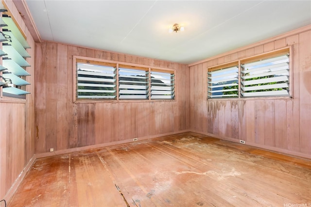 3038 Lanikaula St, Honolulu, HI 96822 - empty room with hardwood / wood-style floors and wood walls