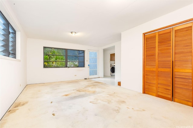 3038 Lanikaula St, Honolulu, HI 96822 - unfurnished bedroom featuring washer / clothes dryer, a closet, and carpet flooring