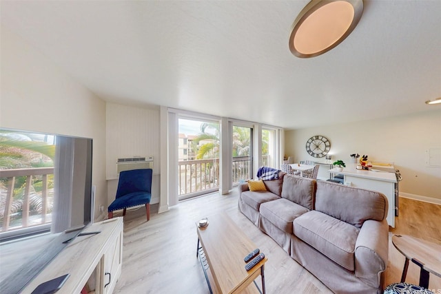 84-687 Ala Mahiku St Unit 120B, Waianae, HI 96792 - living room featuring light wood-style flooring and a wall unit AC