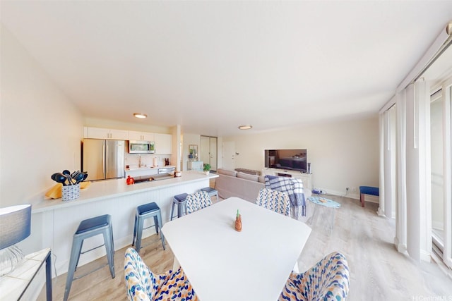 84-687 Ala Mahiku St Unit 120B, Waianae, HI 96792 - dining room with light wood-style flooring and recessed lighting