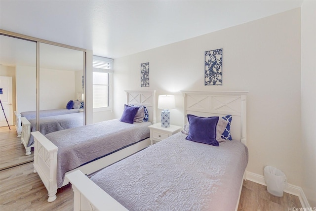 84-687 Ala Mahiku St Unit 120B, Waianae, HI 96792 - bedroom featuring light wood-type flooring and a closet