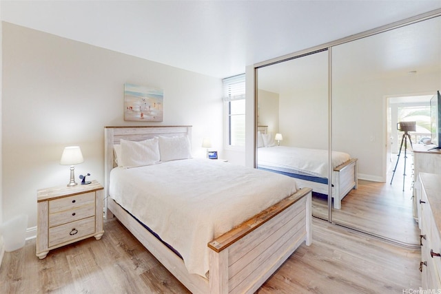 84-687 Ala Mahiku St Unit 120B, Waianae, HI 96792 - bedroom with light wood finished floors, multiple windows, and a closet