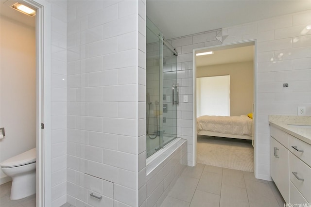 520 Lunalilo Home Rd Unit 8107, Honolulu, HI 96825 - bathroom with a tile shower, tile patterned flooring, vanity, and ensuite bath