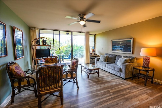 57-101 Kuilima Dr Unit 189, Kahuku, HI 96731 - living area featuring ceiling fan, wood finished floors, and expansive windows