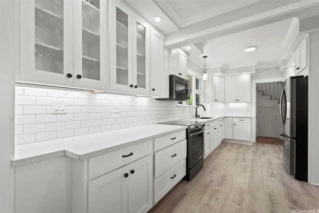 1186 Alewa Dr, Honolulu, HI 96817 - kitchen with appliances with stainless steel finishes, white cabinets, crown molding, backsplash, and light countertops