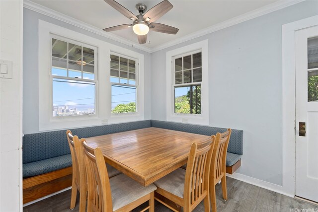 1186 Alewa Dr, Honolulu, HI 96817 - dining area featuring wood finished floors, ornamental molding, and ceiling fan