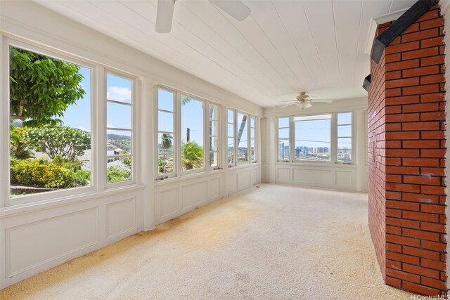 1186 Alewa Dr, Honolulu, HI 96817 - unfurnished sunroom with carpet and a decorative wall