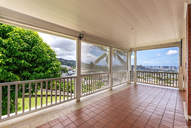 1186 Alewa Dr, Honolulu, HI 96817 - unfurnished sunroom featuring tile patterned floors, a city view, and wooden ceiling