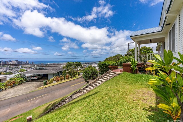 1186 Alewa Dr, Honolulu, HI 96817 - view of green lawn featuring a carport and driveway