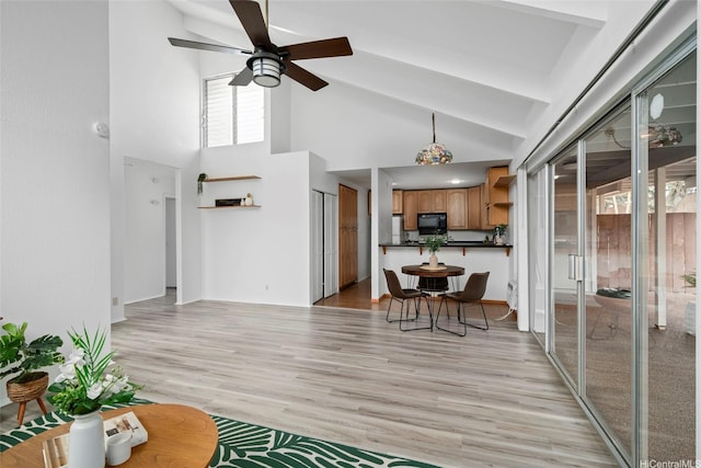 94-043 Keahilele St Unit 114, Mililani, HI 96789 - living area with a ceiling fan, high vaulted ceiling, and light wood-style flooring