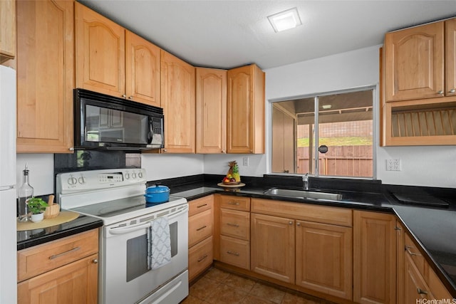 94-043 Keahilele St Unit 114, Mililani, HI 96789 - kitchen featuring white appliances, dark countertops, and dark tile patterned flooring