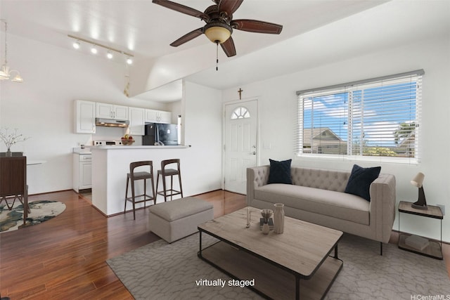 94-510 Lumiaina St Unit J202, Waipahu, HI 96797 - living area featuring lofted ceiling, a ceiling fan, dark wood finished floors, and track lighting