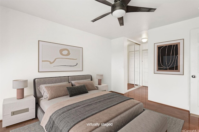 94-510 Lumiaina St Unit J202, Waipahu, HI 96797 - bedroom with wood finished floors and a ceiling fan
