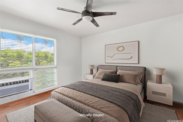94-510 Lumiaina St Unit J202, Waipahu, HI 96797 - bedroom featuring wood finished floors, cooling unit, and ceiling fan
