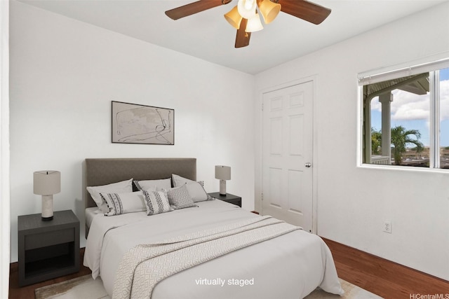94-510 Lumiaina St Unit J202, Waipahu, HI 96797 - bedroom with wood finished floors and a ceiling fan