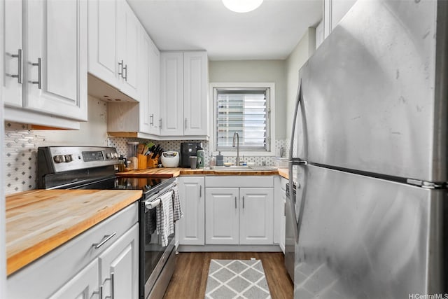 509 University Ave Unit 1001, Honolulu, HI 96826 - kitchen featuring stainless steel appliances, butcher block counters, dark wood-style floors, and white cabinets