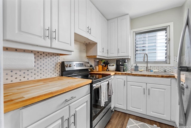 509 University Ave Unit 1001, Honolulu, HI 96826 - kitchen featuring appliances with stainless steel finishes, butcher block counters, white cabinets, and decorative backsplash