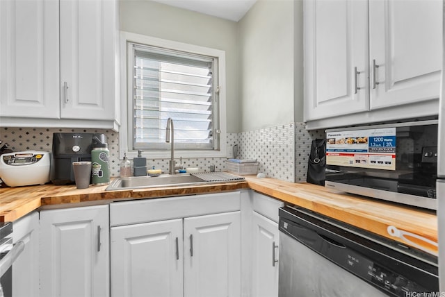 509 University Ave Unit 1001, Honolulu, HI 96826 - kitchen featuring wood counters, dishwasher, white cabinetry, backsplash, and range