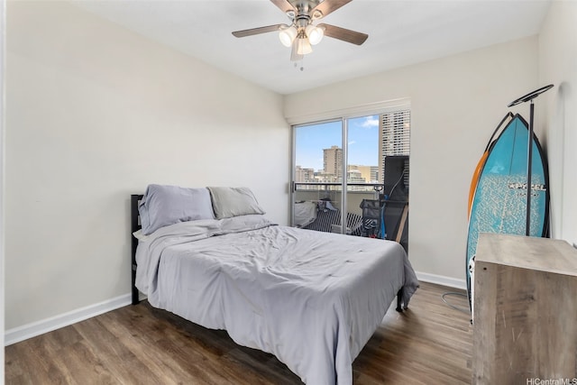 509 University Ave Unit 1001, Honolulu, HI 96826 - bedroom with wood finished floors, a view of city, and a ceiling fan