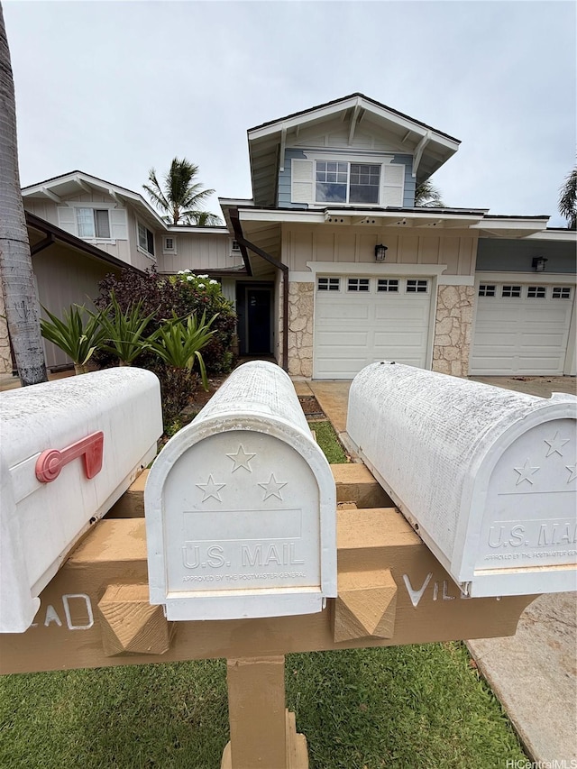 92-1023 Koio Dr Unit M12-5, Kapolei, HI 96707 - view of front of house with a garage and stone siding