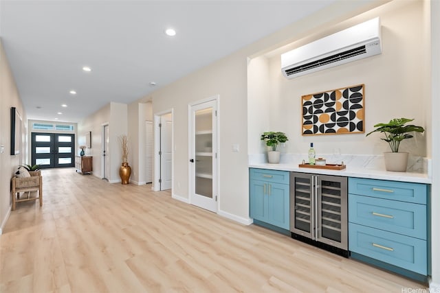 1076 Kahili St, Kailua, HI 96734 - indoor wet bar featuring wine cooler, an AC wall unit, french doors, light wood-style flooring, and recessed lighting