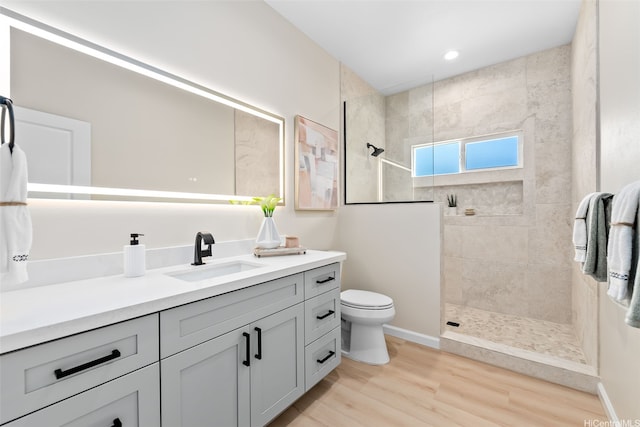 1076 Kahili St, Kailua, HI 96734 - bathroom featuring vanity, a walk in shower, and wood finished floors